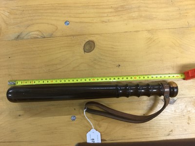 Lot 878 - 20th century turned wood police truncheon with ribbed grip and brown leather strap stamped Hiatt's. B.ham, named in ink W. H. La Touche, 38cm in length