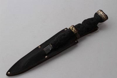 Lot 879 - Two mid 20th century fighting knives in the form of a Scottish Sgian-Dubh daggers with steel blades by J. Nowill & Sons, Sheffield, in leather sheath, larger knife 21cm in length