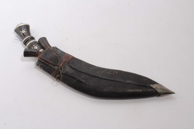 Lot 880 - Old Gurkha Kukri with wooden grip, the blade stamped India, in leather covered sheath, together with an old Tribal knife (2)