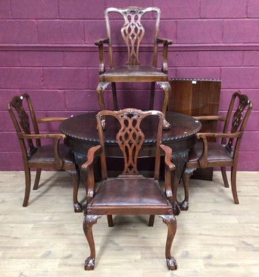 Lot 409 - 1920's mahogany oval dining table with gadrooned edge on carved cabriole legs and claw and ball feet, 128cm x 107cm, and a set of four matching elbow chairs with pierced vase shape splat backs