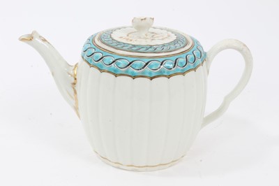 Lot 229 - Worcester fluted teapot and cover, c.1775, painted with a chain link pattern on a light blue ground, flower finial to cover, 12cm high