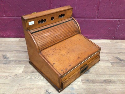 Lot 411 - 1920's oak stationery desk cabinet with tambour front, fold out leather lined writing slope and drawer below