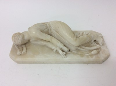 Lot 984 - Small 19th century carved alabaster reclining figure of St. Theresa of Avila