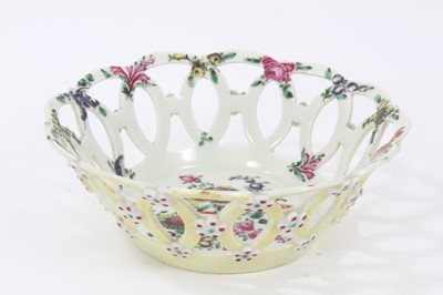 Lot 238 - Worcester yellow-ground pierced round basket, circa 1770, polychrome painted with flowers, 19cm diameter