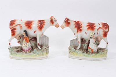 Lot 241 - Pair of Staffordshire pottery cow and milkmaid groups, c.1860, 17.5cm high
