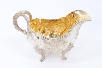 Lot 38 - Two Late 19th Century German Silver Sauce Boats of oval form, from the Royal Prussian Collection, with reeded border, repousse and chased with rocaille, flowers and foliage, with bifurcated foliage...
