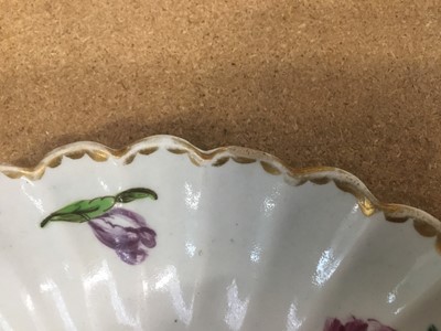Lot 247 - Bow porcelain dish, c.1760, of fluted form, polychrome painted with flowers, 20cm diameter