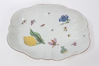 Lot 248 - Chelsea porcelain dish, c.1750-52, polychrome painted with insects, fruit and flowers, the outside pale yellow, 27.5cm long