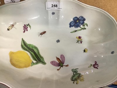 Lot 248 - Chelsea porcelain dish, c.1750-52, polychrome painted with insects, fruit and flowers, the outside pale yellow, 27.5cm long