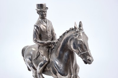 Lot 906 - Bernard Winskill (d. 1980) fine sterling silver model of a horse and rider, in the manner of a dressage competition, hallmarked and raised on black marble plinth, approximately 32cm long