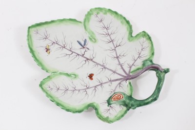 Lot 249 - Worcester leaf-shaped dish, circa 1758-60, polychrome painted with insects, a green edge and handle, and purple veins, 18.5cm long
