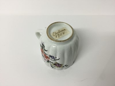 Lot 251 - Derby fluted coffee cup, circa 1756, polychrome painted with flowers, 6cm high