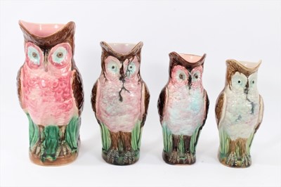 Lot 253 - Four majolica owl jugs, polychrome decorated, measuring between 22cm and 28cm high
