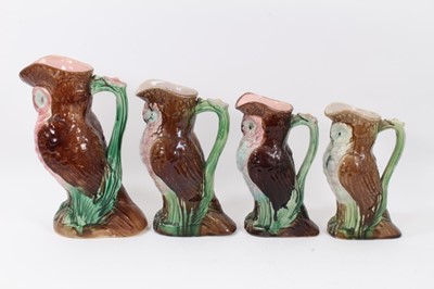 Lot 253 - Four majolica owl jugs, polychrome decorated, measuring between 22cm and 28cm high
