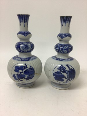 Lot 255 - Pair of 18th/19th century Chinese blue and white triple gourd vases, the main sections ribbed, painted with panels containing precious objects