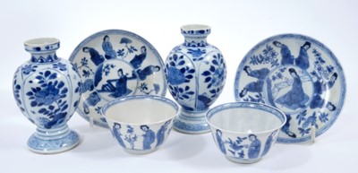 Lot 258 - Pair of small 18th century Chinese blue and white vases, painted with flowers, 9.5cm, and two pairs of 18th century Chinese blue and white tea bowls and saucers, painted with figures (6)