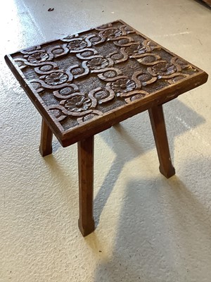 Lot 129 - Edwardian oak and brass two handled tray and a small carved stool