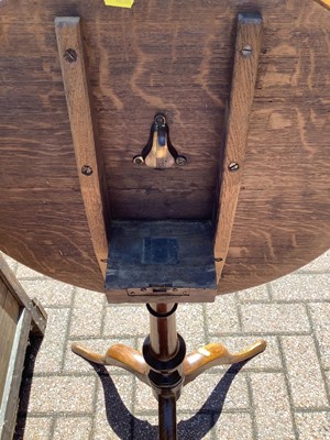 Lot 130 - Antique tilt top wine table on turned column and three splayed legs, 56cm diameter