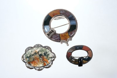 Lot 652 - Three Scottish silver and agate/hard stone brooches