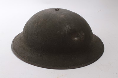 Lot 807 - American M1917A1 pattern steel helmet, with liner and chinstrap, with battle damage to exterior