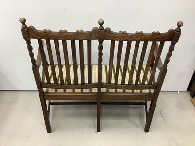 Lot 155 - 1920's oak rail back two seater bench with spiral twist supports