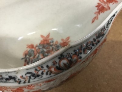 Lot 263 - Lowestoft sauceboat, of large moulded form, painted in blue with flower sprays highlighted in red enamel and gold, 21cm long, together with a Lowestoft coffee cup, of faceted form with scrolled han...