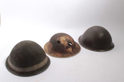 Lot 809 - Second World War British miltary MK III Steel helmet circa 1943 / 44, together with another MK III helmet (minus chin strap and liner) and a British MKII steel helmet originally 8th Army, found nea...