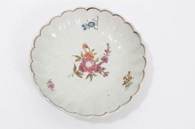 Lot 270 - Collection of Lowestoft pieces, including a tea bowl and saucer of fluted form, painted with scattered flower sprays and sprigs, a further tea bowl and saucer printed in blue with a Chinese river s...