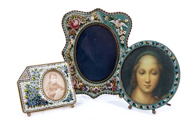 Lot 888 - Late 19th / early 20th century micro mosaic photo frame, of cartouche shaped form with oval glazed aperture, total height 13cm, aperture 9 x 6cm, together with two others. (3)