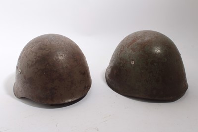 Lot 815 - Portugese M40 pattern steel helmet, with liner and chin strap, together with an Italian M33 pattern steel helmet with liner and chin strap (2)