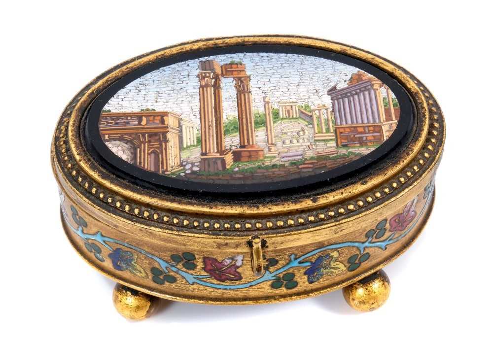 Lot 890 - Late 19th / early 20th century Italian micro mosaic box, of oval form, with inset view of the Forum, and foliate enamel border raised on bun feet, with makers mark to underside of lid for C & R Tom...