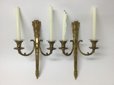 Lot 818 - Pair of Empire style gilt metal twin branch wall lights