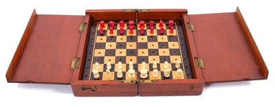 Lot 957 - Late 19th/early 20th century 32 piece Whittington style Travelling Chess Set, with natural and red stained, turned and carved bone pieces, in a folding mahogany case with inlaid rosewood and satin...