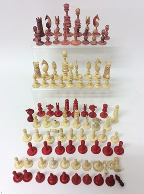 Lot 961 - Early 19th century, turned and carved, red and white stained English Chess Set with looped over head Knights and tall Rooks with flared battlements. King 8.5cm/ 33/8inches overall height. (Some dam...