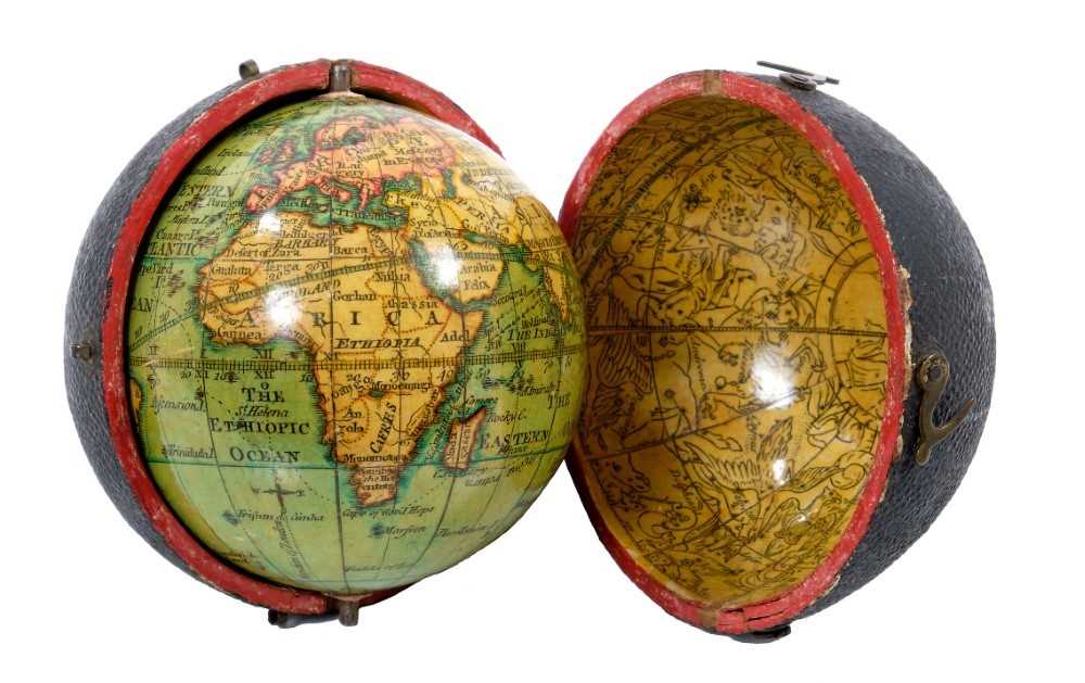 Lot 932 - Fine late 18th / early 19th century terrestrial pocket globe, signed Minshulls charting the voyage of Cooke, with original shagreen case, the interior with celestial map, 3 inches diameter