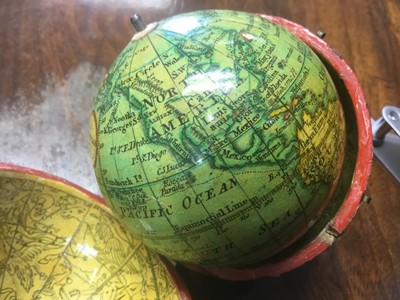 Lot 932 - Fine late 18th / early 19th century terrestrial pocket globe, signed Minshulls charting the voyage of Cooke, with original shagreen case, the interior with celestial map, 3 inches diameter