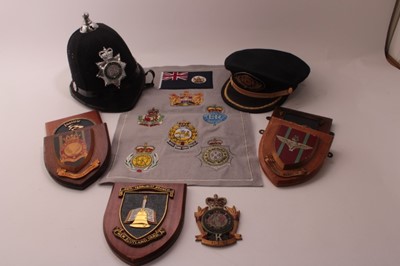 Lot 816 - Large collection of Police and miltary crests on wooden shields, together with a Royal Parks Constabulary helmet and a Police hat (1 box)