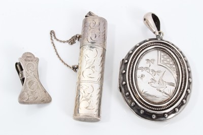 Lot 145 - Victorian silver oval locket pendant, silver bodkin case and small silver clip