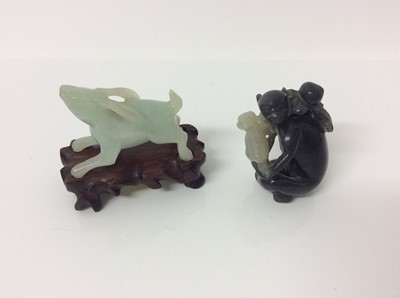 Lot 943 - Chinese jade or green hardstone carving, depicting a family of monkeys, utilising the colours in the stone, 3cm high, together with a pair of jade or green hardstone figures of reclining buffalo an...