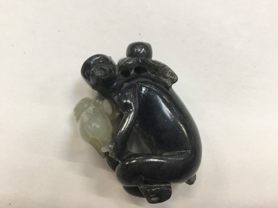 Lot 943 - Chinese jade or green hardstone carving, depicting a family of monkeys, utilising the colours in the stone, 3cm high, together with a pair of jade or green hardstone figures of reclining buffalo an...
