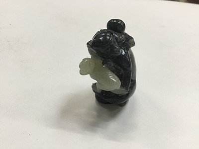Lot 943 - Chinese jade or green hardstone carving, depicting a family of monkeys, utilising the colours in the stone, 3cm high, together with a pair of jade or green hardstone figures of reclining buffalo an...
