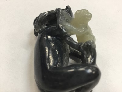 Lot 943 - Chinese jade or green hardstone carving, depicting a family of monkeys, utilising the colours in the stone, 3cm high, together with a pair of jade or green hardstone figures of reclining buffalo an...