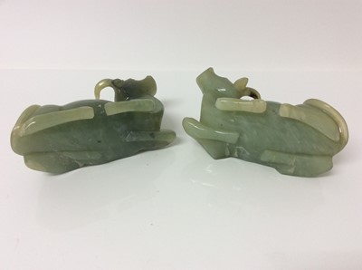 Lot 943 - Chinese jade or green hardstone carving, depicting a family of monkeys, utilising the colours in the stone, 3cm high, together with a pair of jade or green hardstone figures of reclining buffalo an...