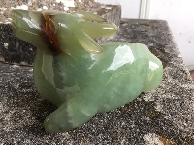 Lot 943 - Chinese jade or green hardstone carving, depicting a family of monkeys, utilising the colours in the stone, 3cm high, together with a pair of jade or green hardstone figures of reclining buffalo an...