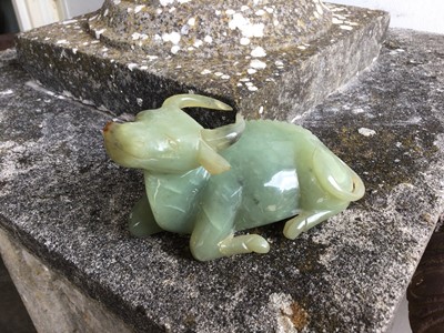 Lot 943 - Chinese jade or green hardstone carving, depicting a family of monkeys, utilising the colours in the stone, 3cm high, together with a pair of jade or green hardstone figures of reclining buffalo an...