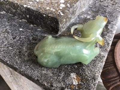 Lot 943 - Chinese jade or green hardstone carving, depicting a family of monkeys, utilising the colours in the stone, 3cm high, together with a pair of jade or green hardstone figures of reclining buffalo an...