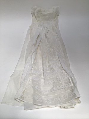 Lot 1949 - Babies clothing including linen cap with smocking and lace inserts, silk and embroidered net lace cap, white-work Christening gown and white lawn lace and embroidered petticoat both handstitched.