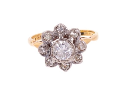 Lot 618 - Diamond cluster ring with a flower head cluster of diamonds