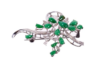 Lot 620 - Chinese 18k white gold and green jade brooch