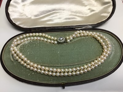 Lot 625 - Cultured pearl two strand necklace in a Victorian necklace box